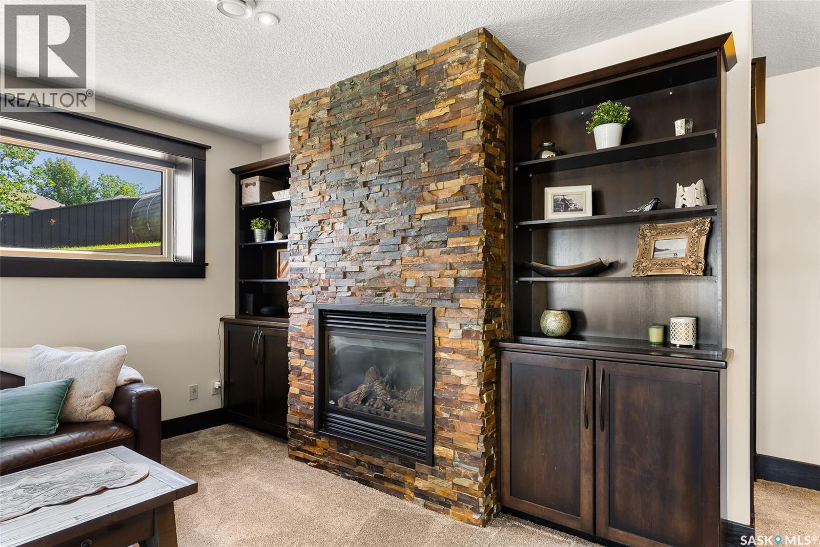 15 Meadow Bay, Lumsden, SK - Indoor Photo Showing Living Room With Fireplace