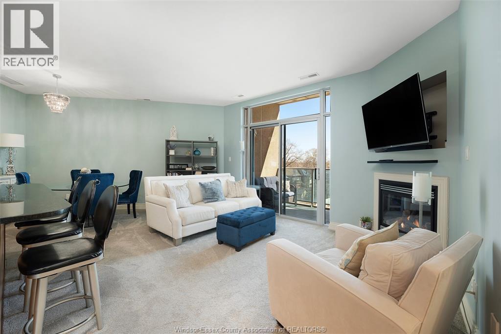 1225 Riverside Unit# 409, Windsor, ON - Indoor Photo Showing Living Room With Fireplace