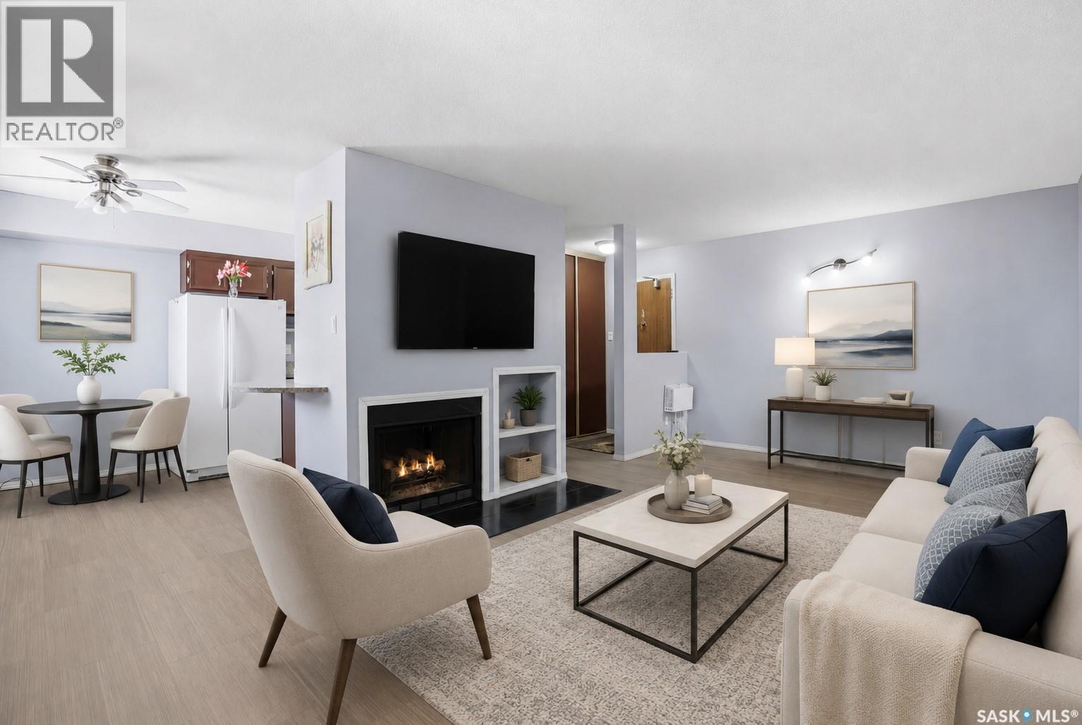 206 31 Rodenbush Drive, Regina, SK - Indoor Photo Showing Living Room With Fireplace