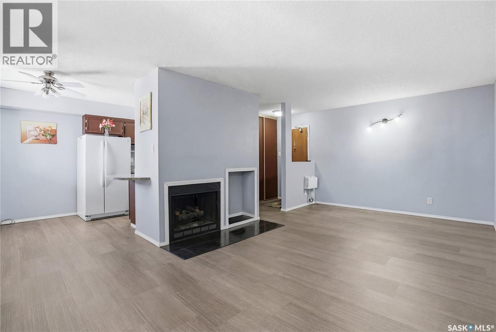 206 31 Rodenbush Drive, Regina, SK - Indoor With Fireplace
