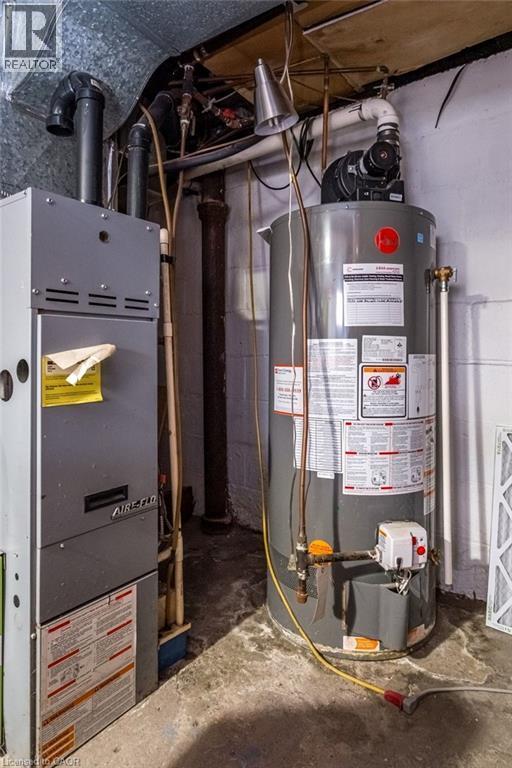 Furnace room with a newer water tank. - 500 Ferguson Avenue N, Hamilton, ON - Indoor Photo Showing Basement