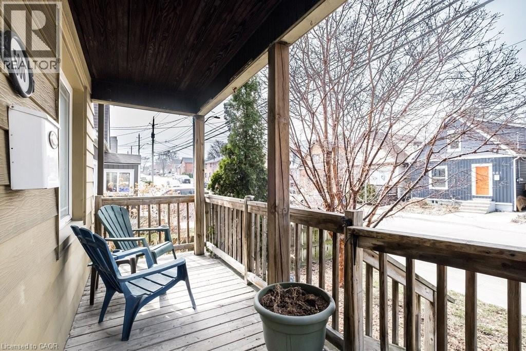 Charming front porch, a great spot to relax and connect with neighbours and enjoy the community. - 500 Ferguson Avenue N, Hamilton, ON - Outdoor With Exterior
