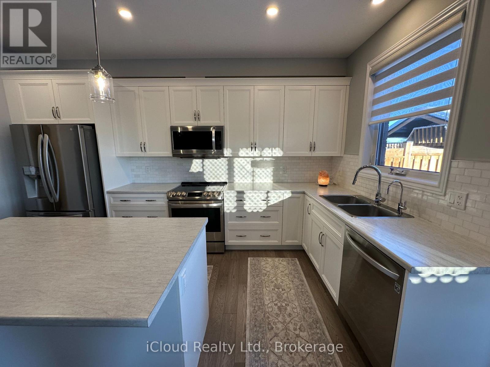 106 Queensgate Crescent, Woolwich, ON - Indoor Photo Showing Kitchen With Double Sink With Upgraded Kitchen