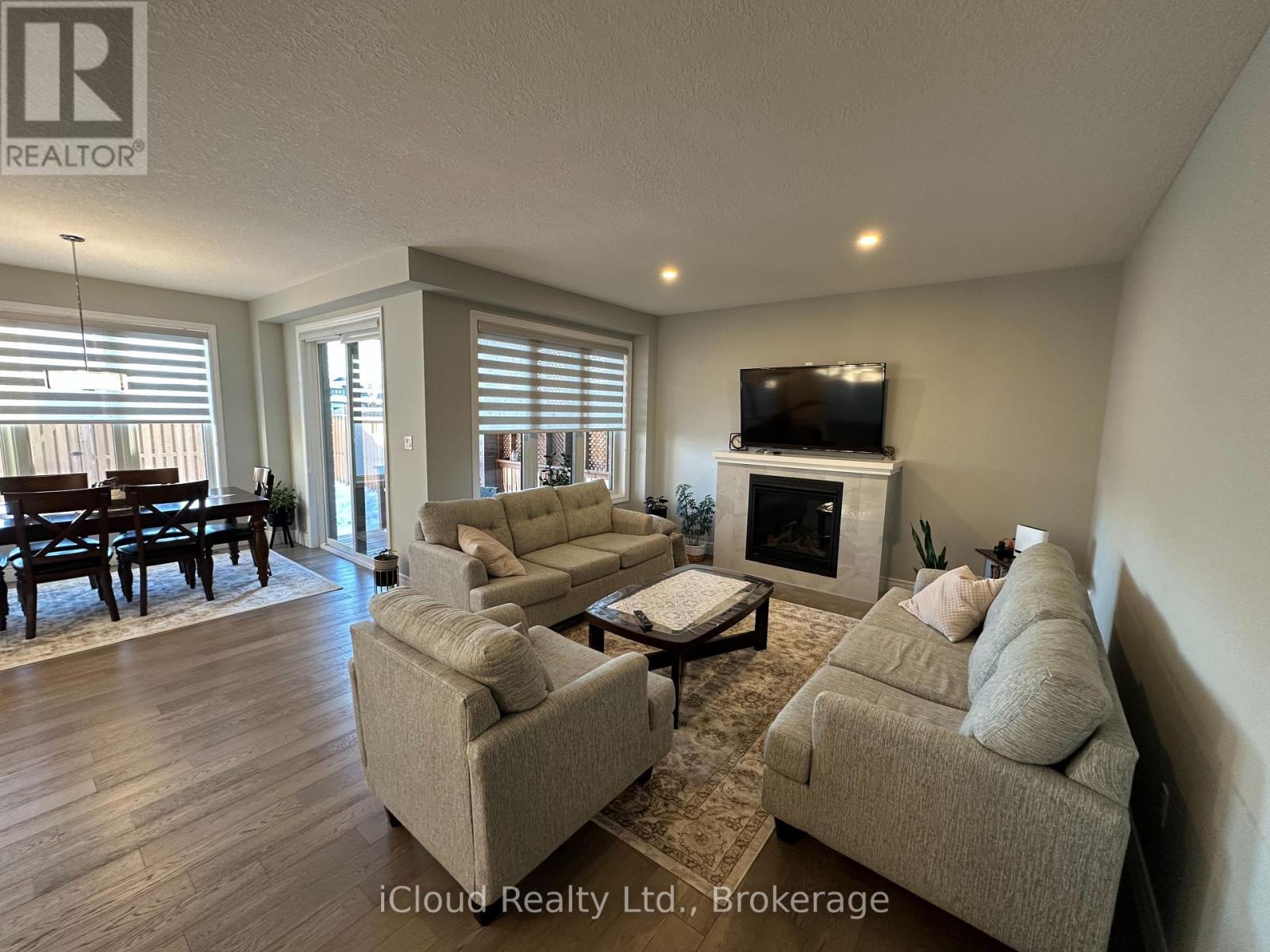 106 Queensgate Crescent, Woolwich, ON - Indoor Photo Showing Living Room With Fireplace