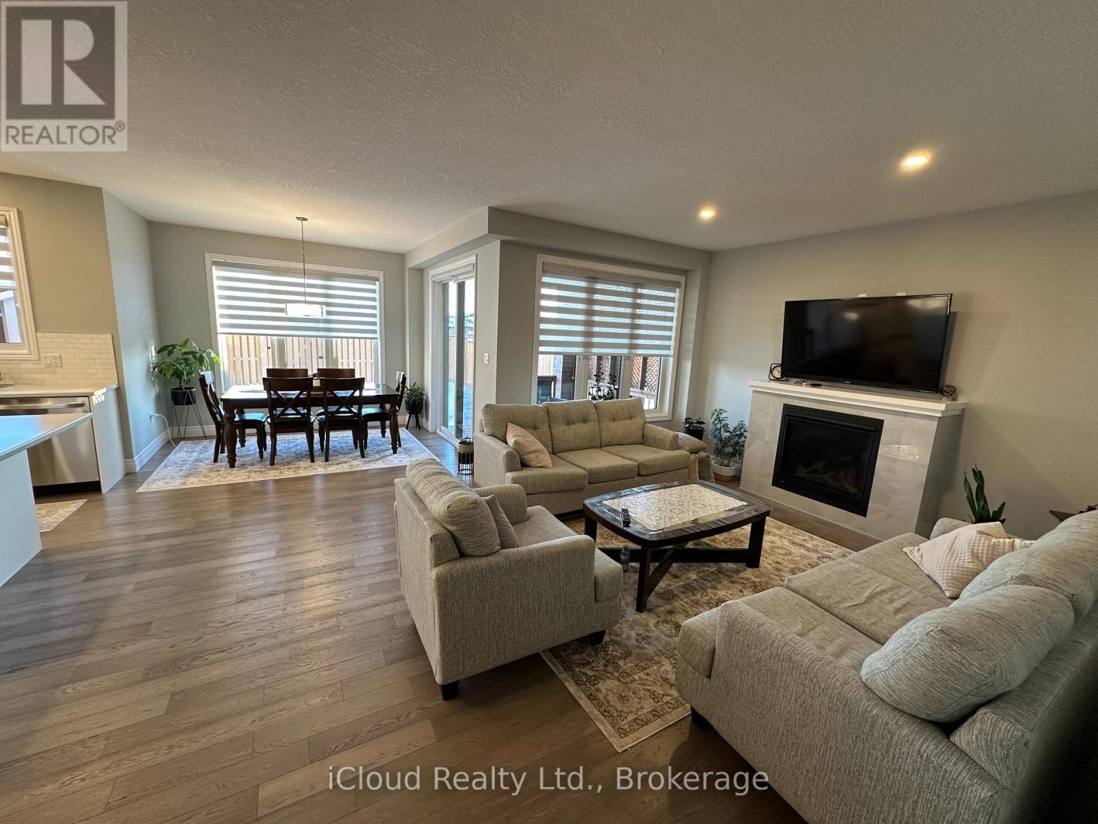 106 Queensgate Crescent, Woolwich, ON - Indoor Photo Showing Living Room With Fireplace