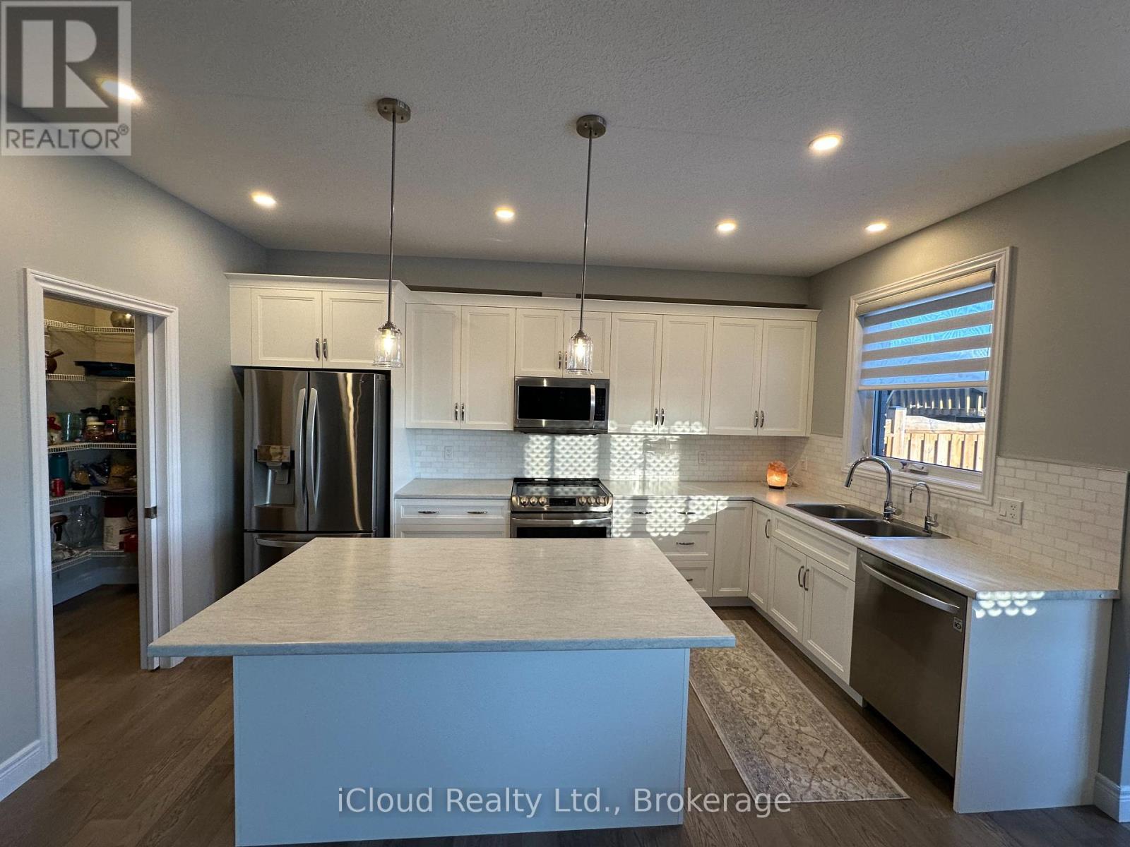 106 Queensgate Crescent, Woolwich, ON - Indoor Photo Showing Kitchen With Double Sink