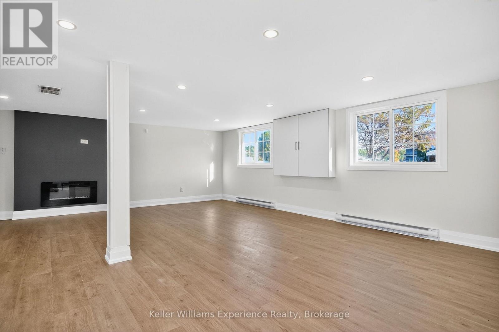 556 Champlain Road, Tiny, ON - Indoor Photo Showing Other Room With Fireplace