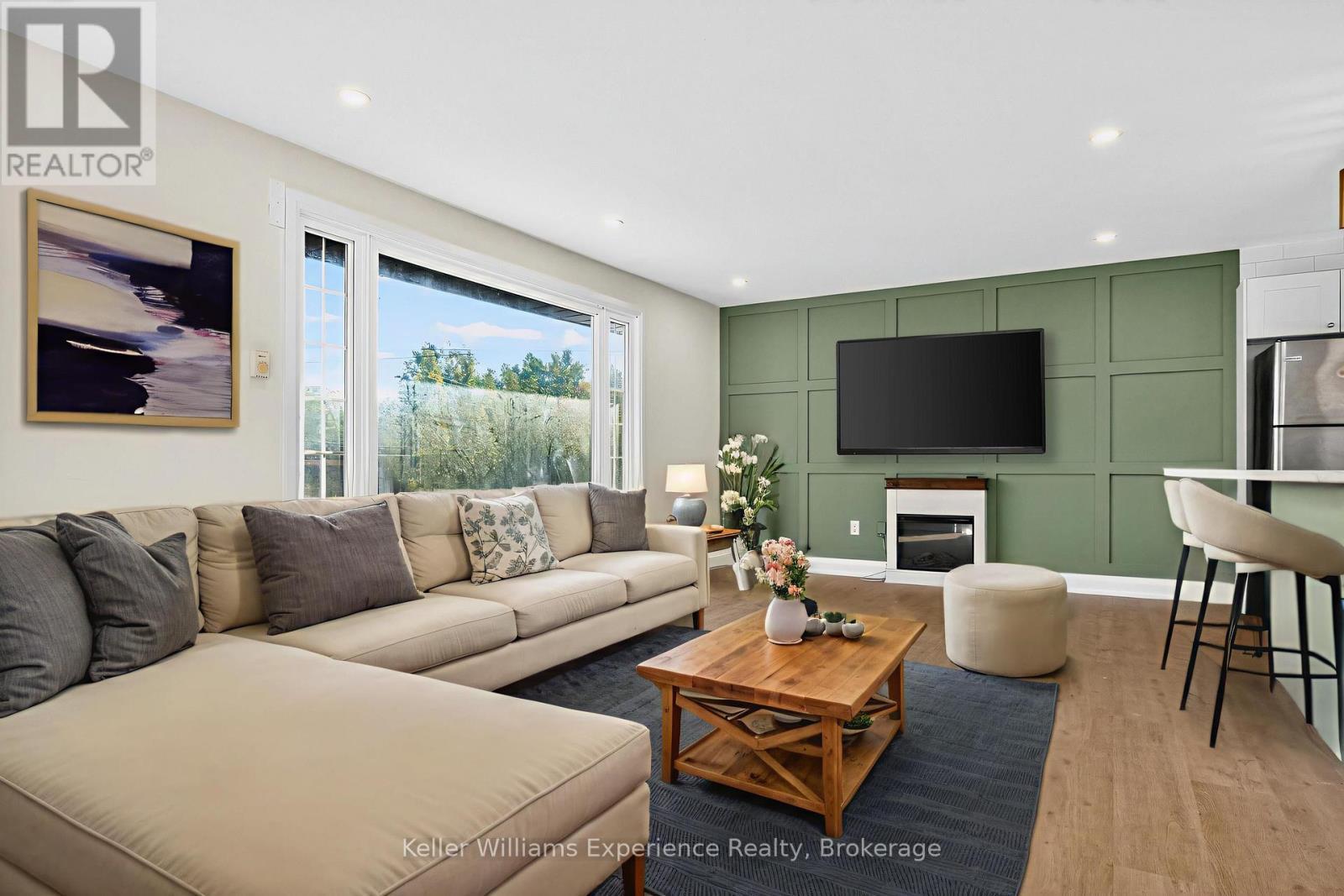 Digitally Staged - 556 Champlain Road, Tiny, ON - Indoor Photo Showing Living Room With Fireplace