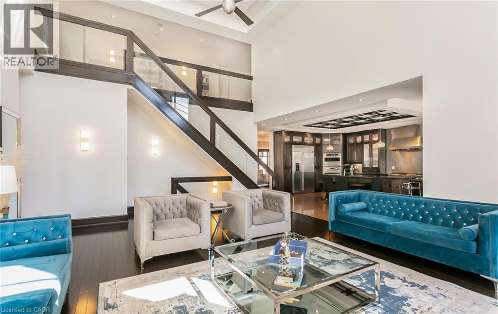 Living area with wood-type flooring, ceiling fan, and a high ceiling - 24 Jacob Gingrich Drive, Kitchener, ON - Indoor