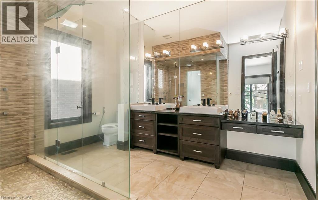 Bathroom with double vanity, a stall shower, and light tile patterned flooring - 24 Jacob Gingrich Drive, Kitchener, ON - Indoor Photo Showing Bathroom