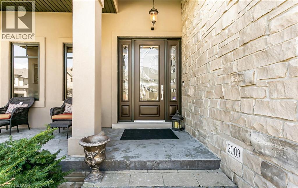View of exterior entry with stucco siding and covered porch - 24 Jacob Gingrich Drive, Kitchener, ON - With Exterior