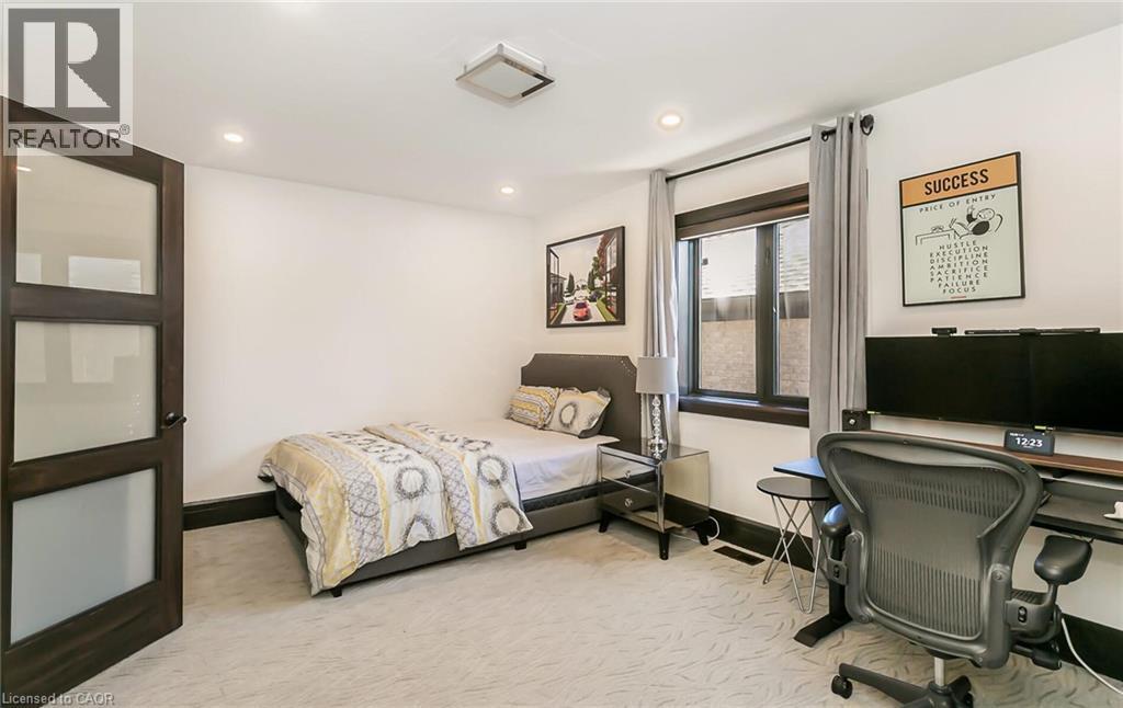 Bedroom featuring light carpet, a desk, and recessed lighting - 24 Jacob Gingrich Drive, Kitchener, ON - Indoor