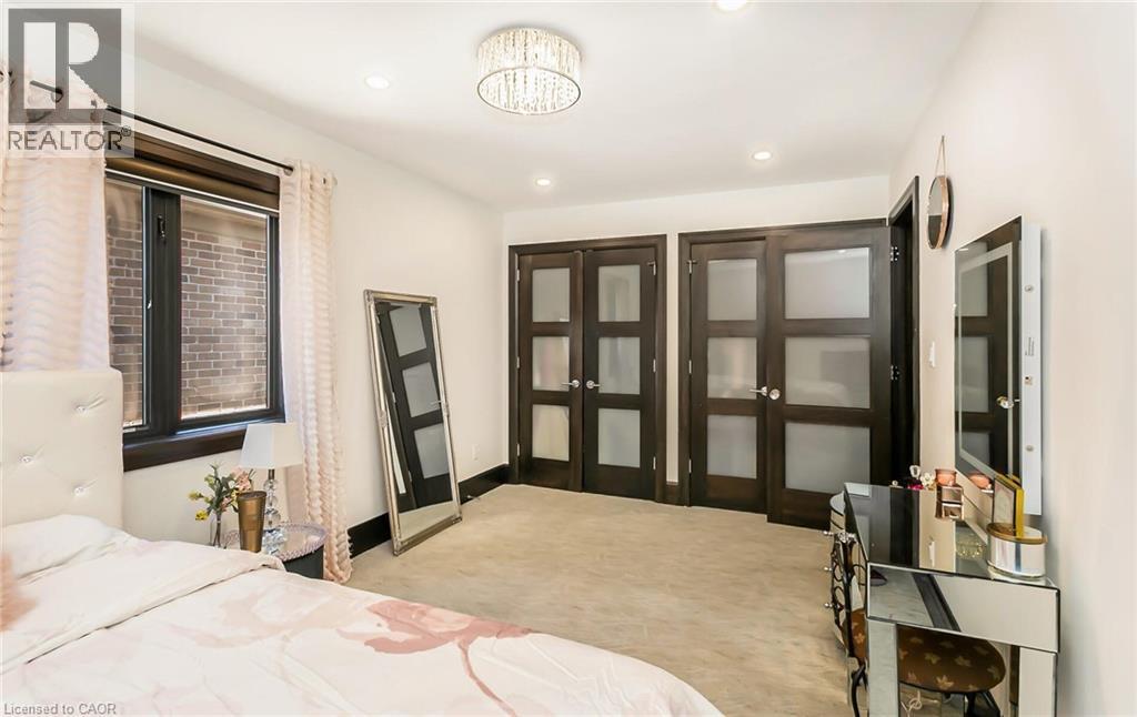 Bedroom featuring light carpet and recessed lighting - 24 Jacob Gingrich Drive, Kitchener, ON - Indoor Photo Showing Bedroom