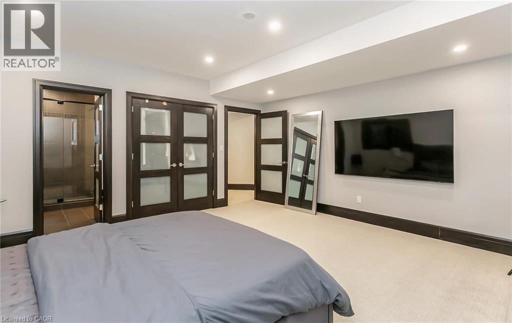 Bedroom featuring carpet, ensuite bath, and recessed lighting - 24 Jacob Gingrich Drive, Kitchener, ON - Indoor Photo Showing Bedroom