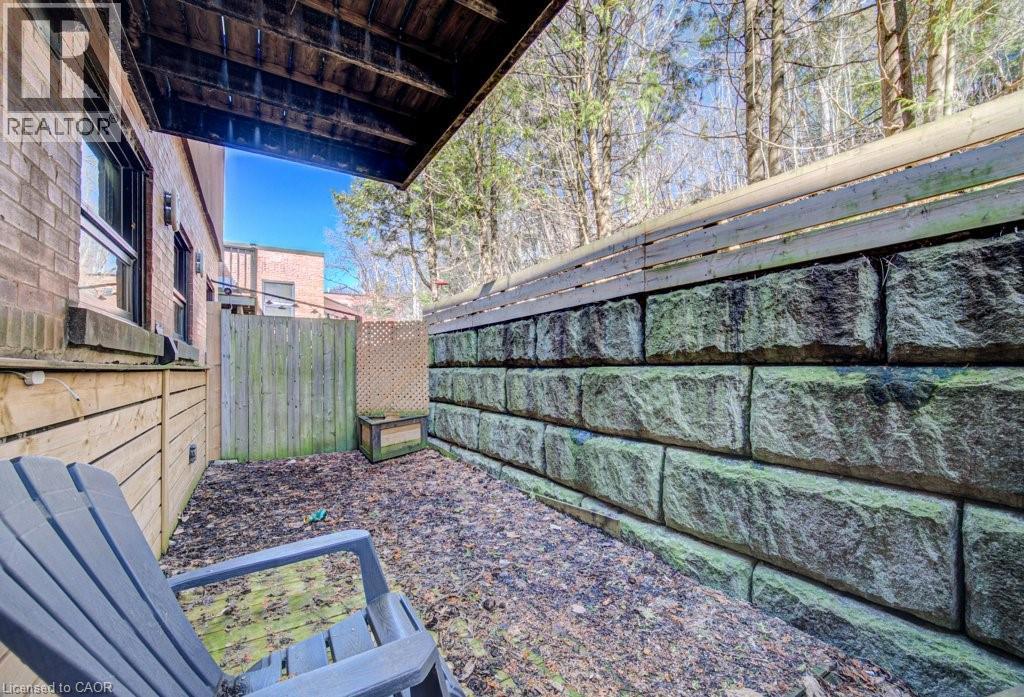 View of fenced yard - 85 Spruce Street Unit# 103, Cambridge, ON - Outdoor