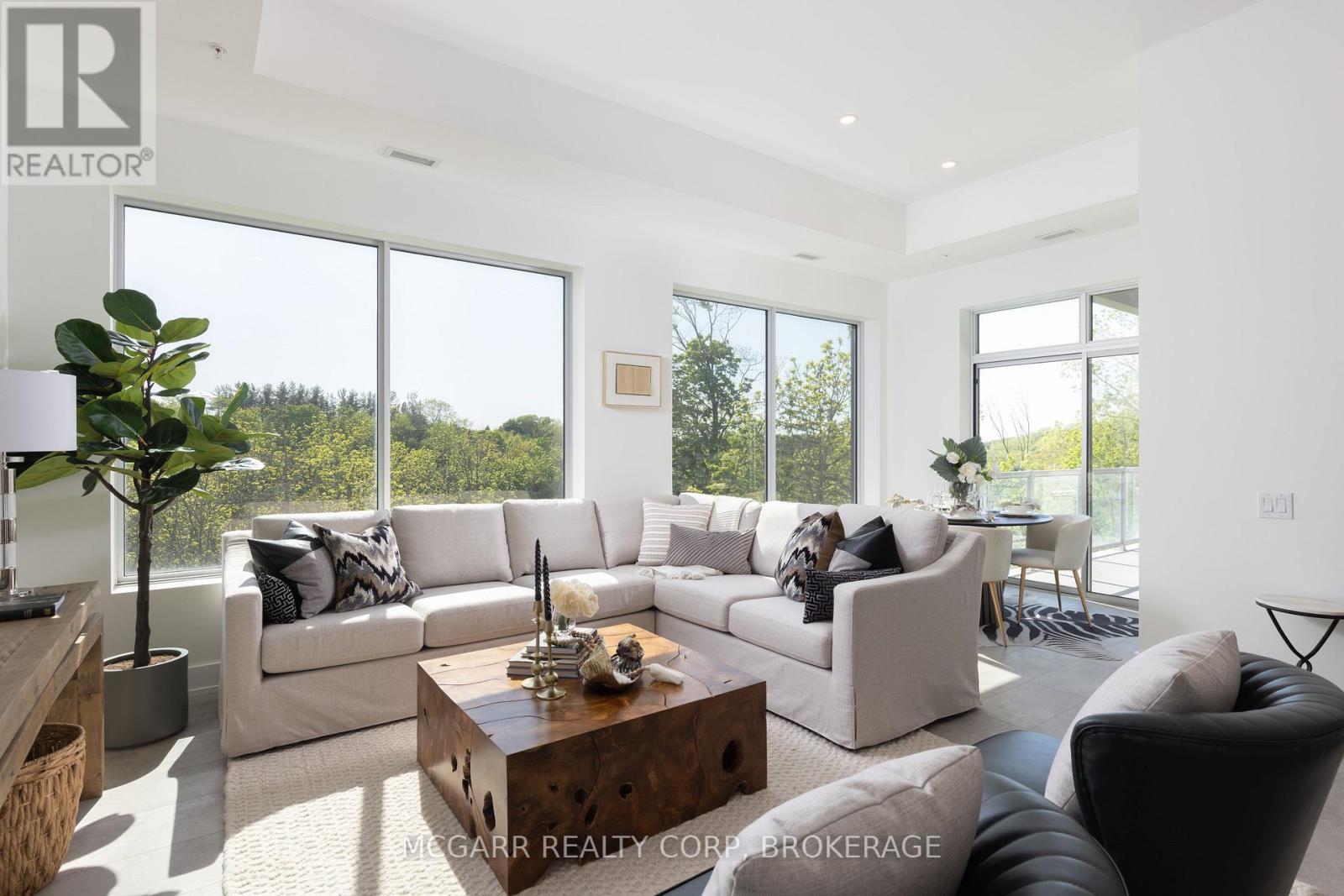 Lots of greenery and blue sky views - 403 - 77 Yates Street, St. Catharines (Downtown), ON - Indoor Photo Showing Living Room