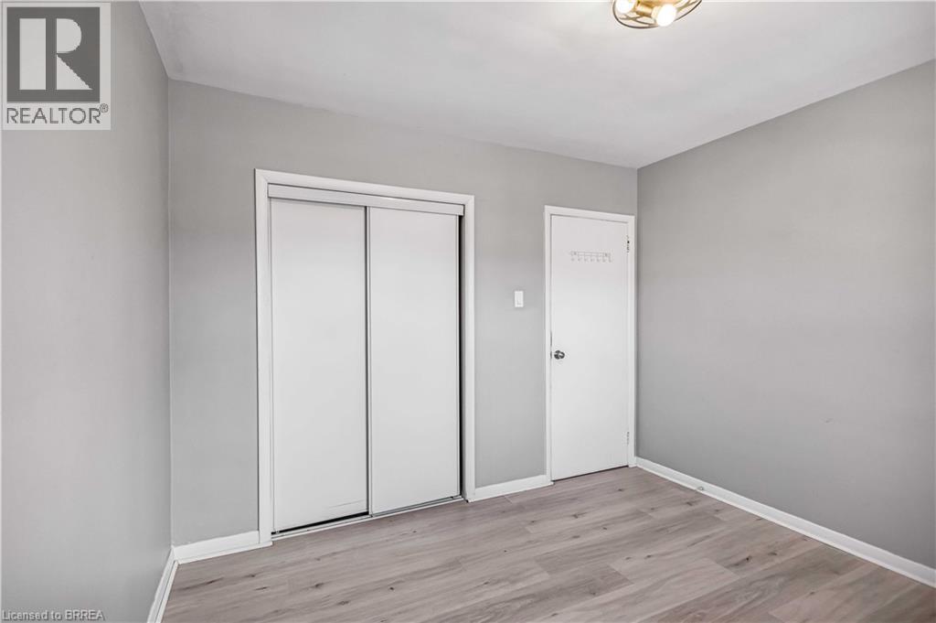 Unfurnished bedroom featuring light wood-style floors and a closet - 151 Siebert Avenue, Kitchener, ON - Indoor Photo Showing Other Room