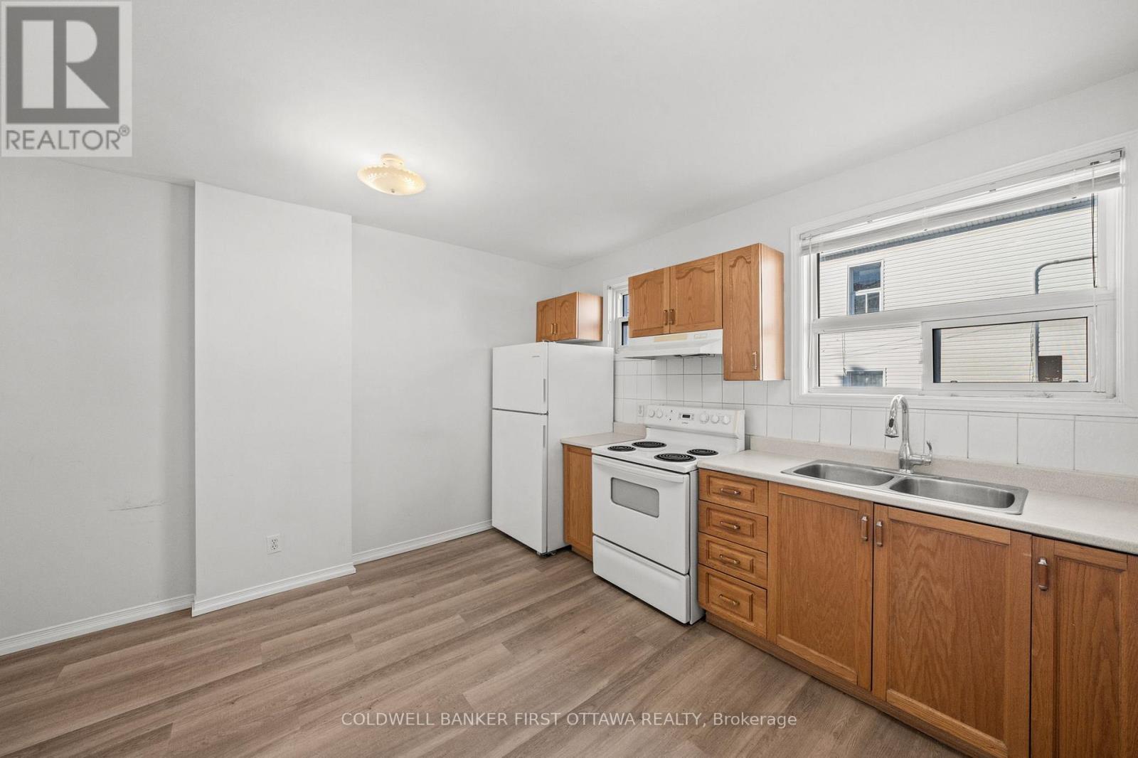 Space for kitchen table and ample storage. - 234 Rochester Street, Ottawa, ON - Indoor Photo Showing Kitchen With Double Sink