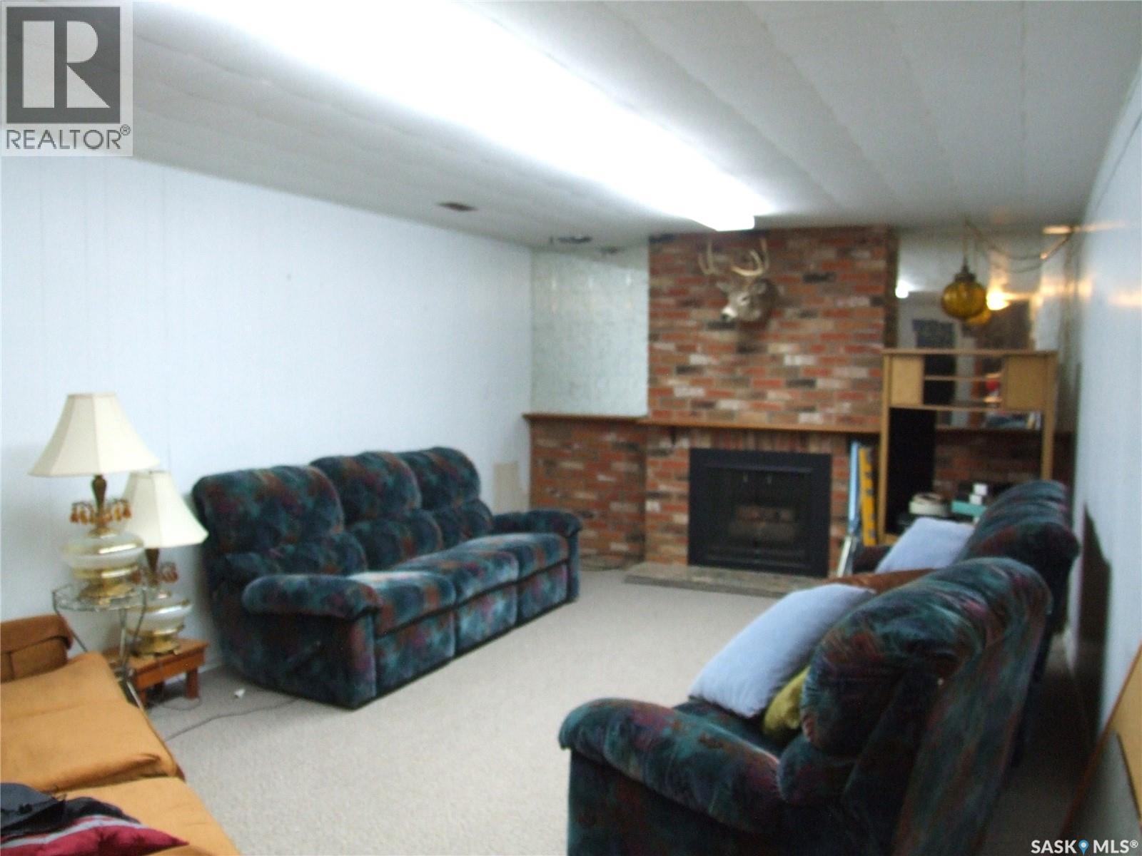 301 5Th Street W, Leader, SK - Indoor Photo Showing Living Room With Fireplace