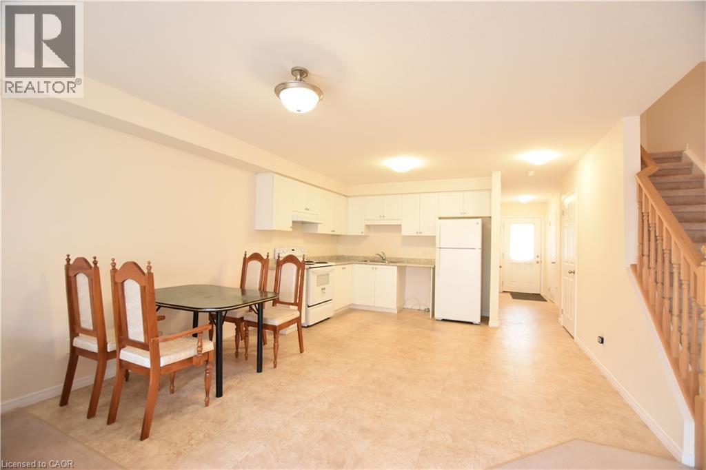 Dining space with stairs and light flooring - 52 Meadowridge Street, Kitchener, ON - Indoor