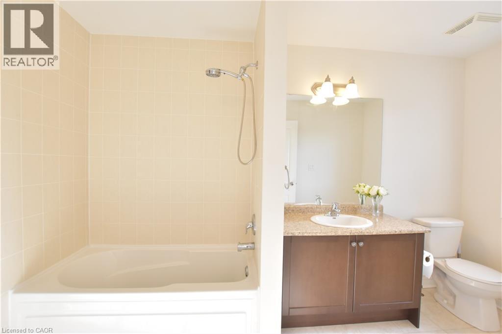 Full bath featuring vanity and tub / shower combination - 512 Terrington Crescent, Kitchener, ON - Indoor Photo Showing Bathroom