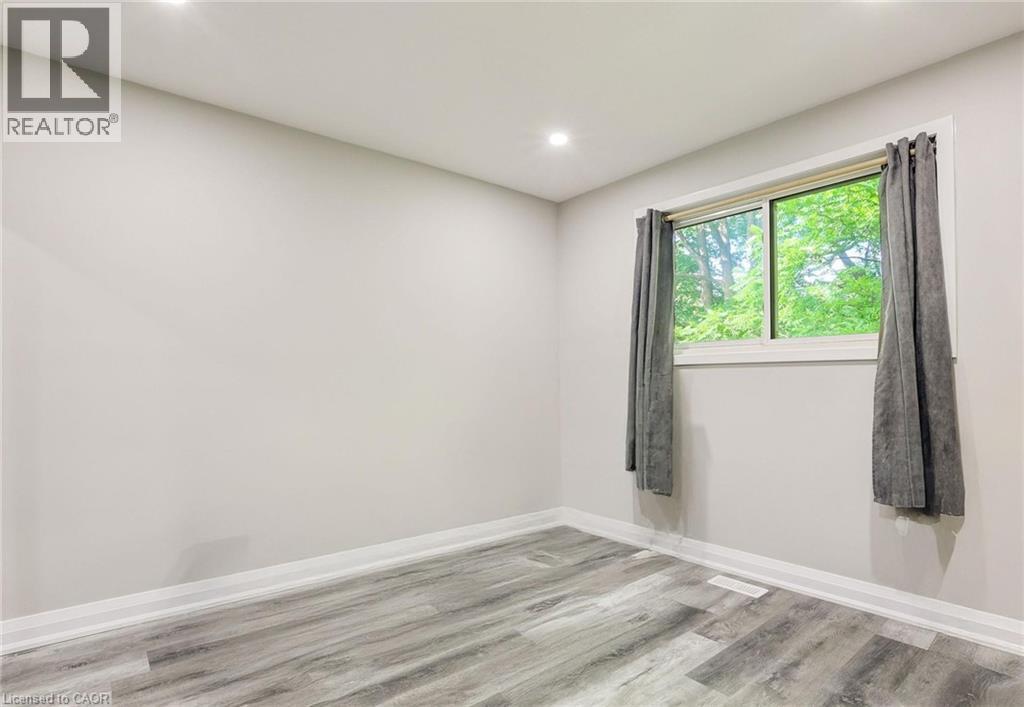 Spare room with light wood finished floors and recessed lighting - 7 Cardill Crescent, Waterloo, ON - Indoor Photo Showing Other Room