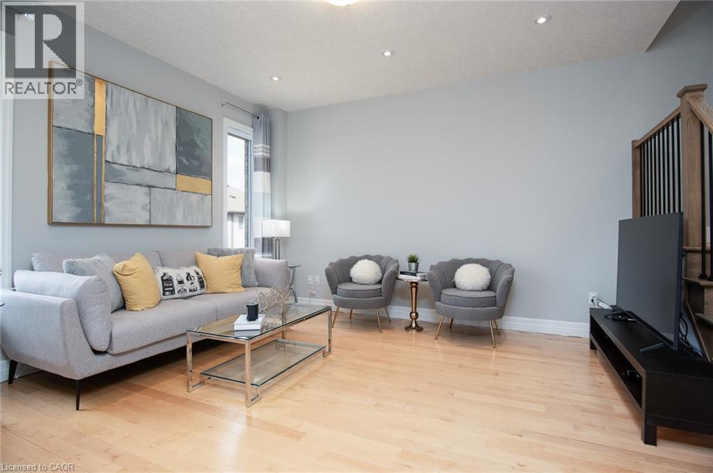 Living room with light wood-type flooring and recessed lighting - 346 Chokecherry Crescent, Waterloo, ON - Indoor Photo Showing Living Room