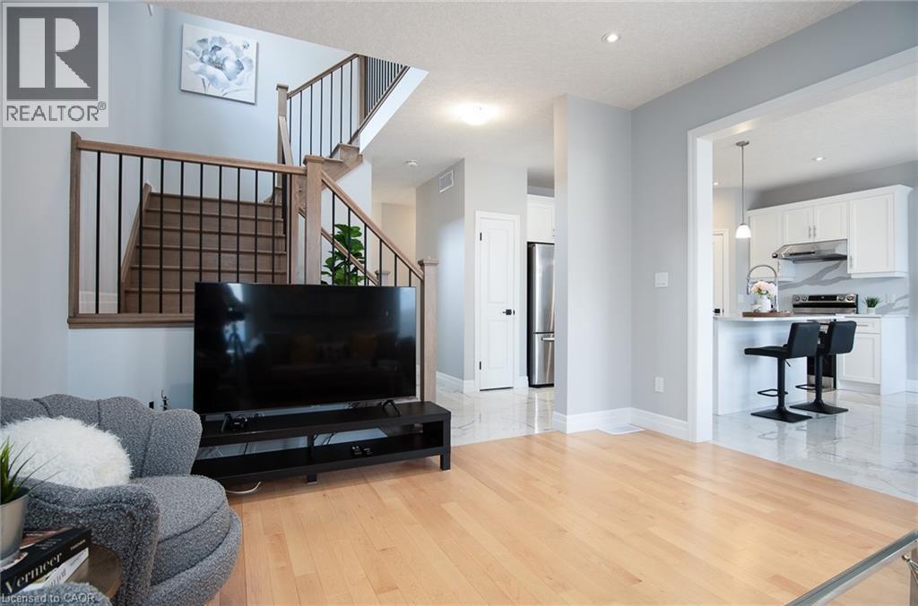 Living room featuring light wood-type flooring and recessed lighting - 346 Chokecherry Crescent, Waterloo, ON - Indoor Photo Showing Living Room