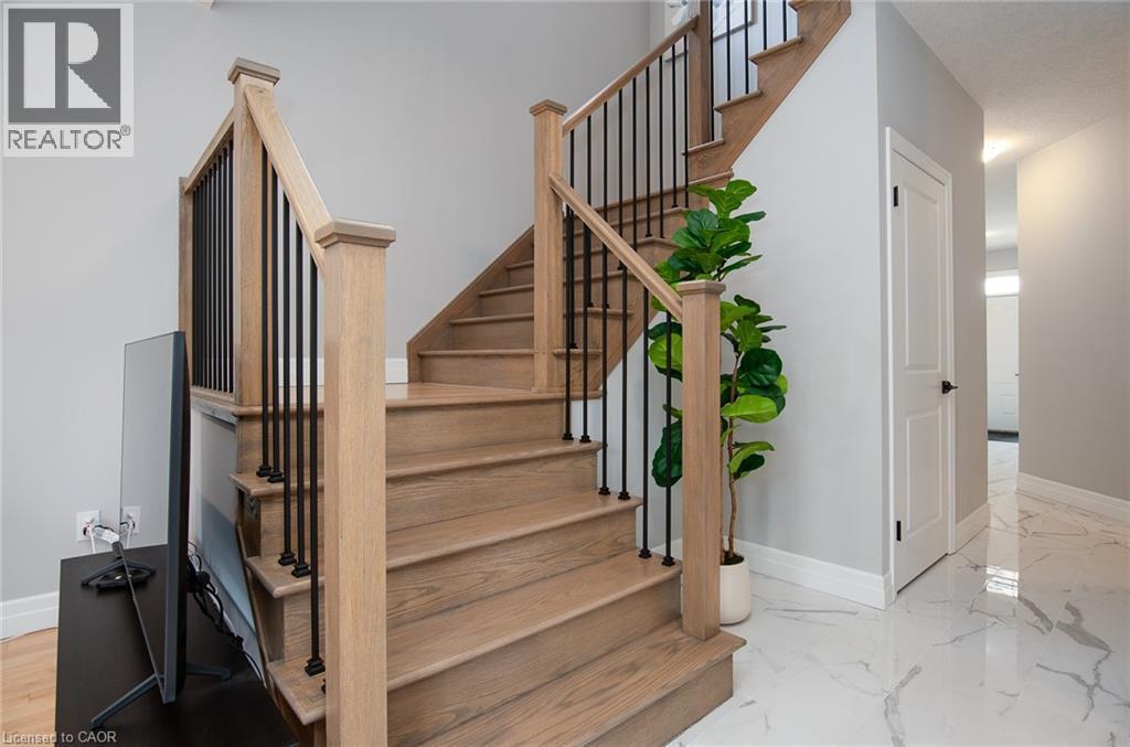 Stairs with baseboards - 346 Chokecherry Crescent, Waterloo, ON - Indoor Photo Showing Other Room
