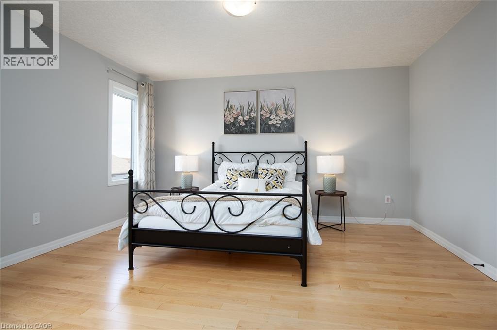 Bedroom with light wood-style flooring and baseboards - 346 Chokecherry Crescent, Waterloo, ON - Indoor Photo Showing Other Room