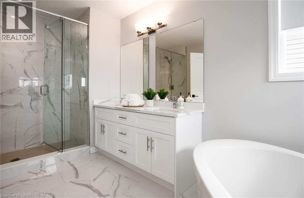 Full bathroom with double vanity, a marble finish shower, a soaking tub, and light marble finish flooring - 346 Chokecherry Crescent, Waterloo, ON - Indoor Photo Showing Bathroom