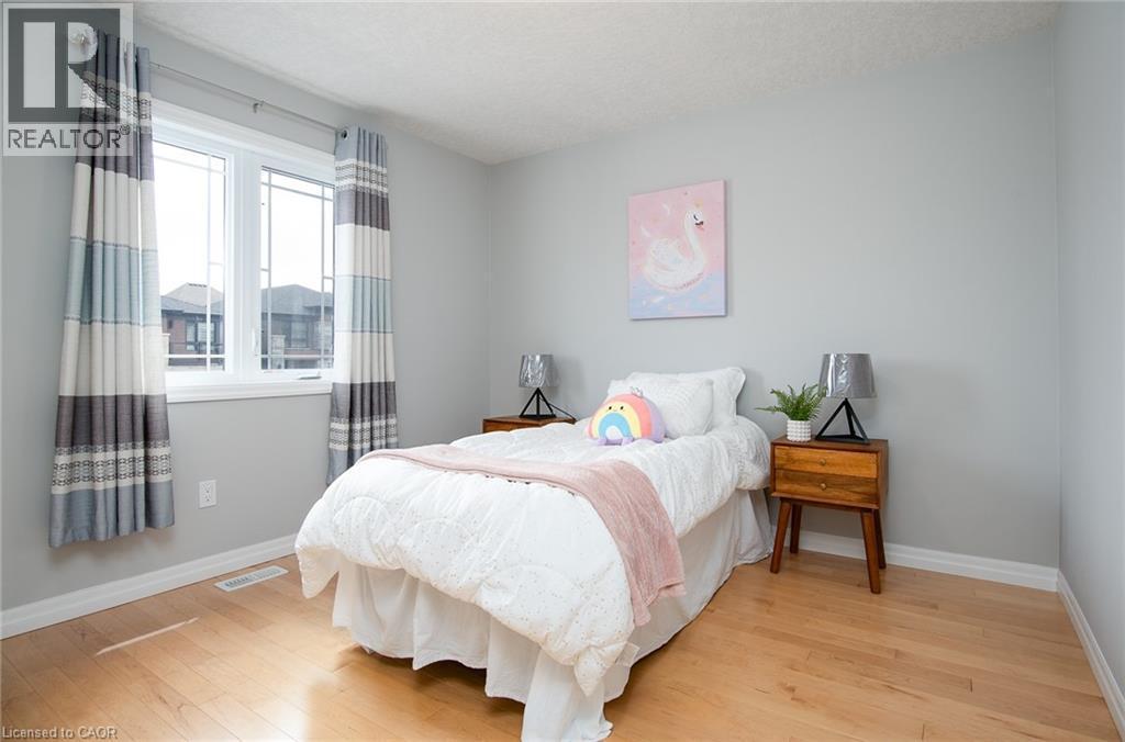 Bedroom featuring light wood-type flooring and baseboards - 346 Chokecherry Crescent, Waterloo, ON - Indoor Photo Showing Bedroom