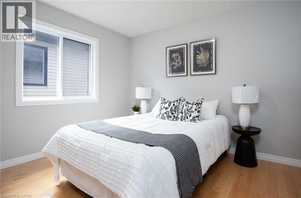 Bedroom with baseboards and light wood-type flooring - 346 Chokecherry Crescent, Waterloo, ON - Indoor Photo Showing Bedroom
