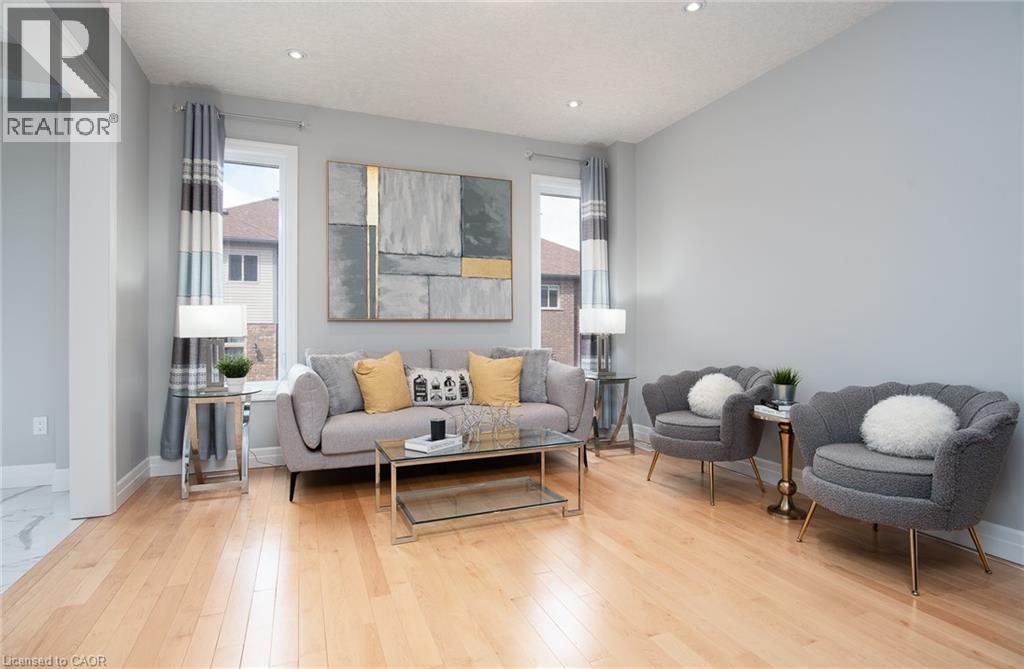 Living room with healthy amount of natural light, light wood-type flooring, and recessed lighting - 346 Chokecherry Crescent, Waterloo, ON - Indoor Photo Showing Living Room