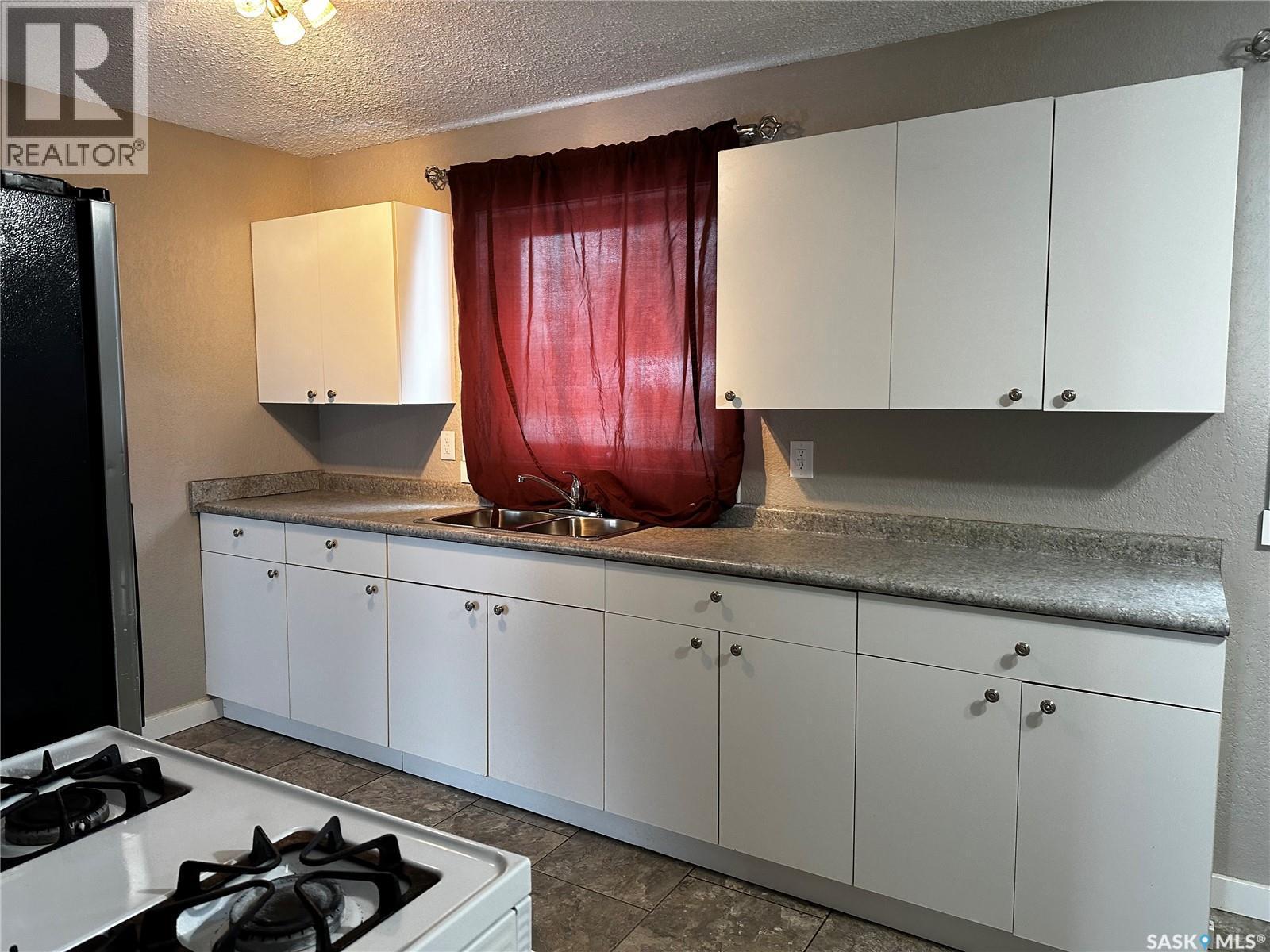 619 Guy Place, La Ronge, SK - Indoor Photo Showing Kitchen With Double Sink