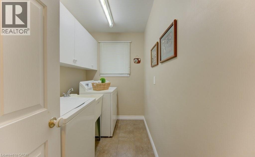 Main floor with sink - 594 Hunters Place, Waterloo, ON - Indoor Photo Showing Laundry Room