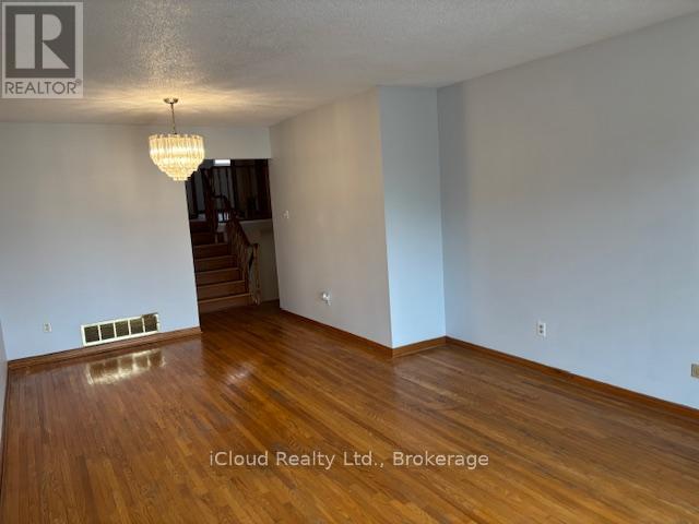 Strip Hardwood Floors - 4174 Woodington Drive, Mississauga, ON - Indoor Photo Showing Other Room
