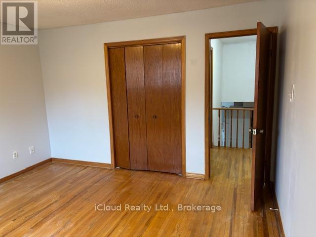 Strip Hardwood Floors - 4174 Woodington Drive, Mississauga, ON - Indoor Photo Showing Other Room