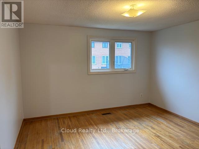 Strip Hardwood Floors - 4174 Woodington Drive, Mississauga, ON - Indoor Photo Showing Other Room