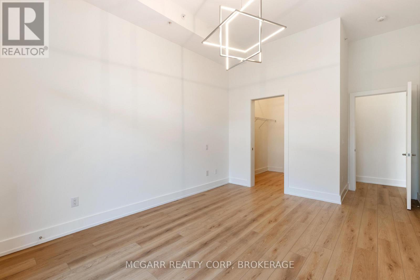 Primary suite with W.I. closet and ensuite - 507 - 77 Yates Street, St. Catharines (Downtown), ON - Indoor Photo Showing Other Room