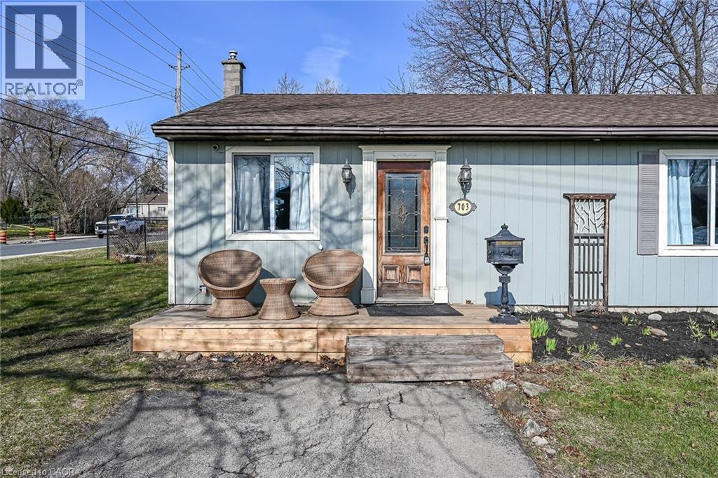 Entrance to property with a chimney and roof with shingles - 703 Dunn Avenue, Hamilton, ON - Outdoor
