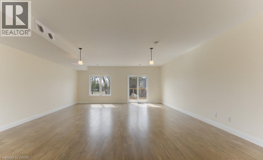 Unfurnished room featuring light wood-style floors and baseboards - 113 Walter Street, Kitchener, ON - Indoor
