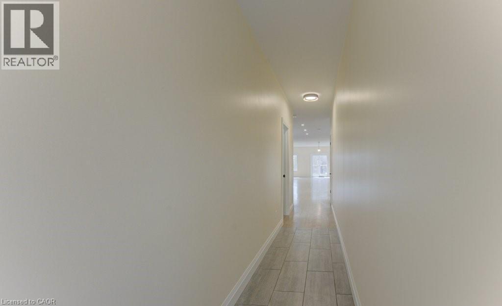 Corridor featuring baseboards and wood tiled floors - 113 Walter Street, Kitchener, ON - Indoor Photo Showing Other Room