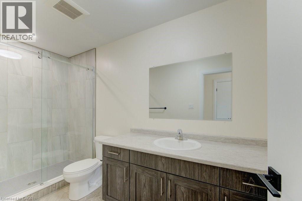 Bathroom featuring vanity and a stall shower - 113 Walter Street, Kitchener, ON - Indoor Photo Showing Bathroom