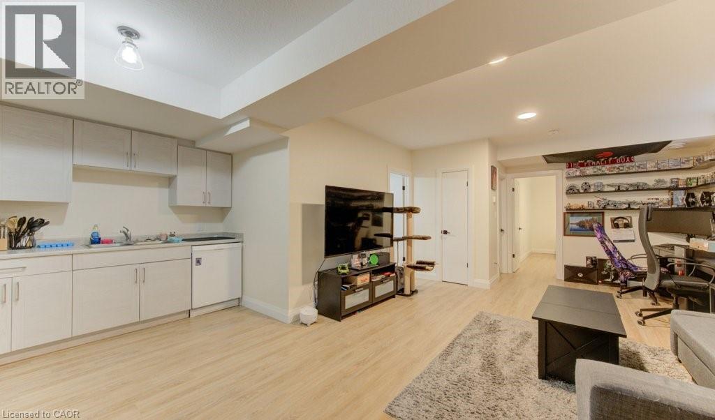 Living room featuring light wood finished floors, a desk, and recessed lighting - 113 Walter Street, Kitchener, ON - Indoor