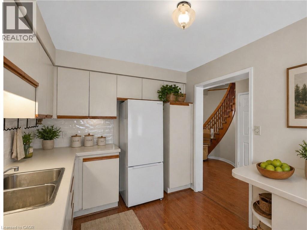 Virtually Staged / Enhanced - 86 Rita Avenue, Hamilton, ON - Indoor Photo Showing Kitchen With Double Sink