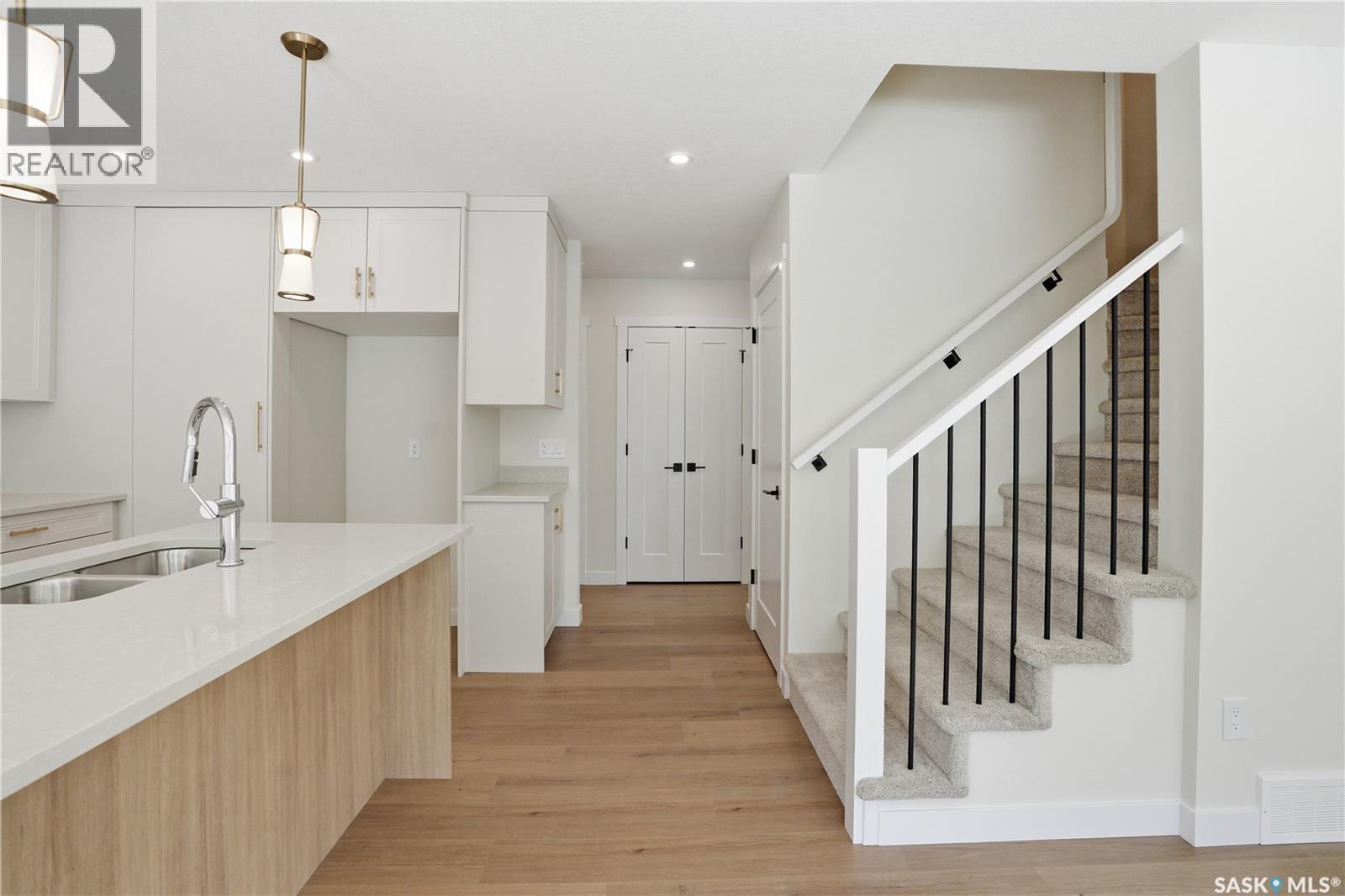 404 155 Mcfaull Way, Saskatoon, SK - Indoor Photo Showing Kitchen With Double Sink