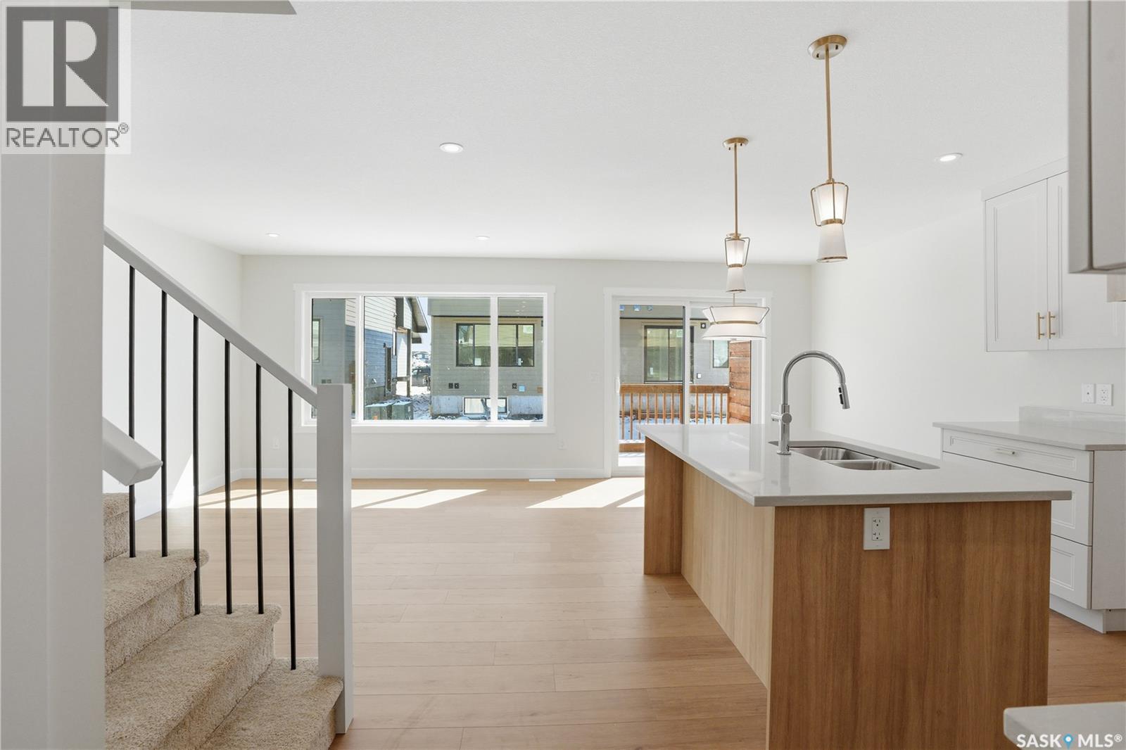 404 155 Mcfaull Way, Saskatoon, SK - Indoor Photo Showing Kitchen With Double Sink