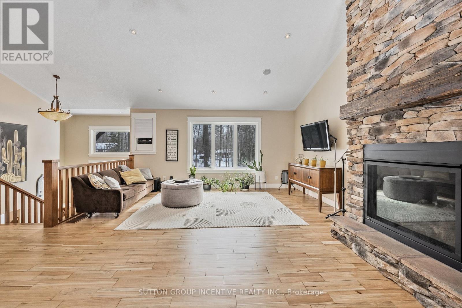 48 Tall Pines Drive, Tiny, ON - Indoor Photo Showing Living Room With Fireplace