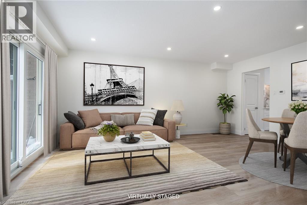 Living room featuring light wood-type flooring and recessed lighting - 27 Queenston Drive, Kitchener, ON - Indoor Photo Showing Living Room